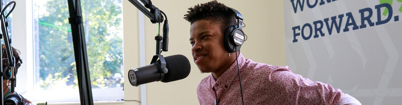 Student in the podcast studio