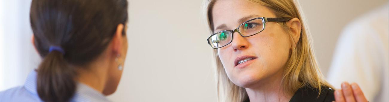Woman speaking to colleague