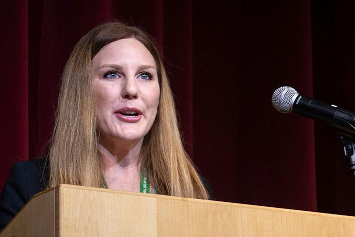 Woman speaks at a podium