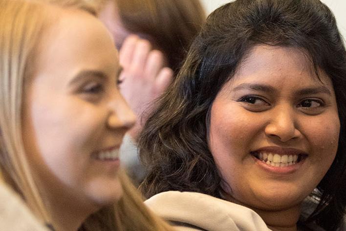 Students laugh in a group