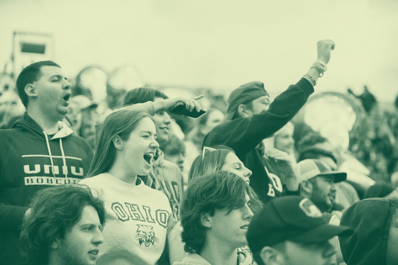 Students at a sporting event cheering
