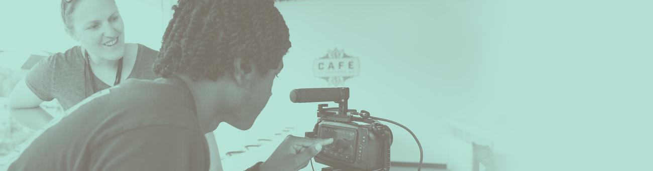 Student working with teacher on capturing video