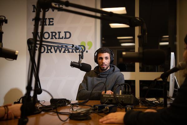 Student records podcast in studio