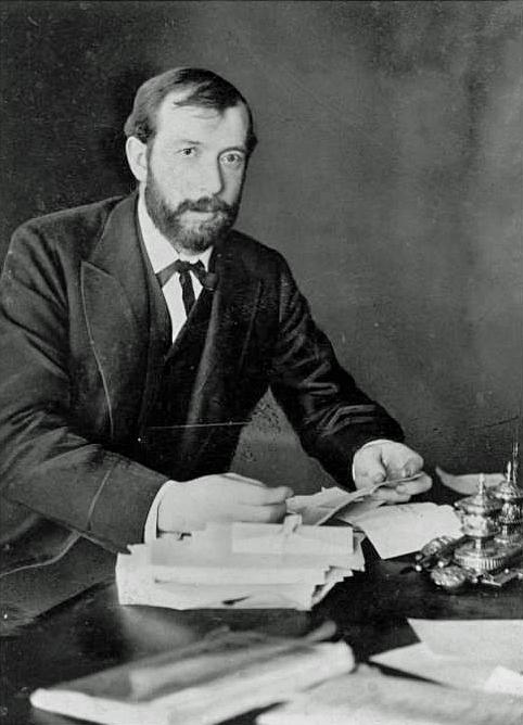 A portrait of E.W. Scripps with books.