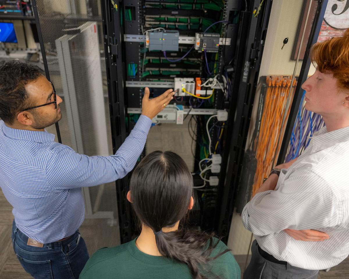 Dr. Das explaining the OT (operational technology) research and teaching setup in the ITS labs.