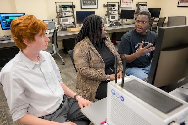 Students work with a 5G setup to study wireless communications