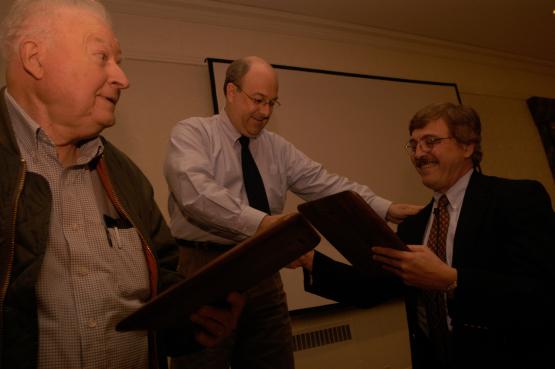 Chuck Scott accepts an award