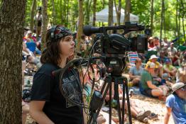 A media arts student films performances at Nelsonville Music Festival