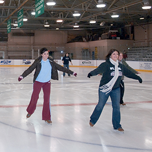 People skating in Bird Ice Arena