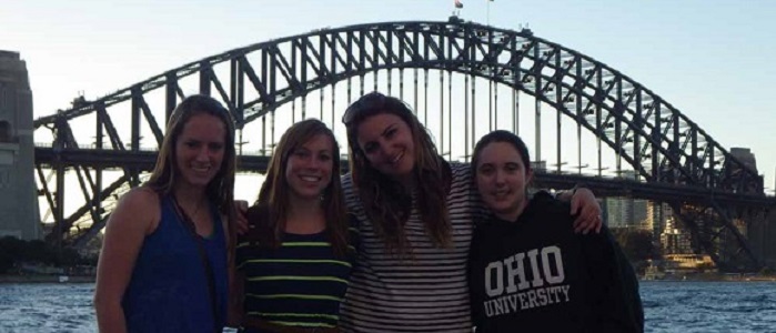 people in front of bridge
