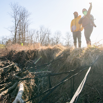 Members of the Voinovich school survey land damage