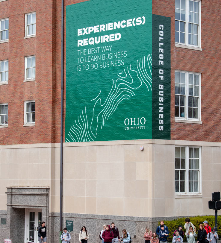 Large billboard graphic applied to campus building