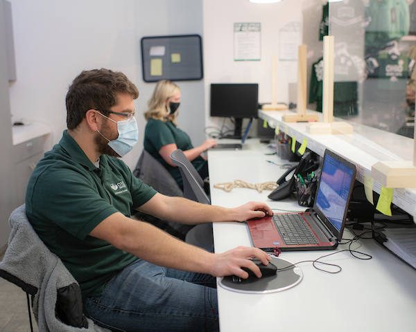 Staff working on computers to provide customer support