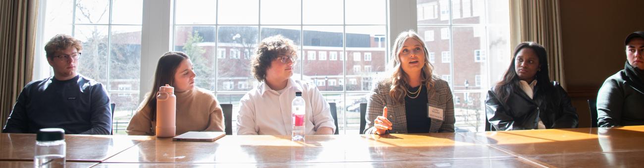 Pre-Law students sitting at a table talking