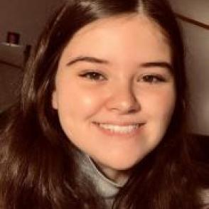 Allison Saaty smiles at the camera.