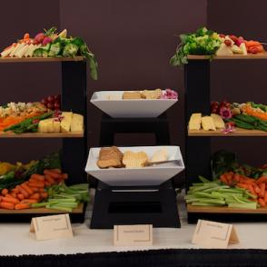 Catered food arranged in tiers on a table