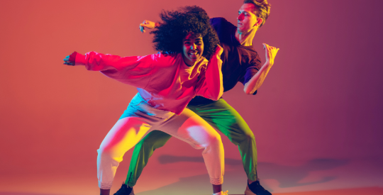 Two people dancing hip hop