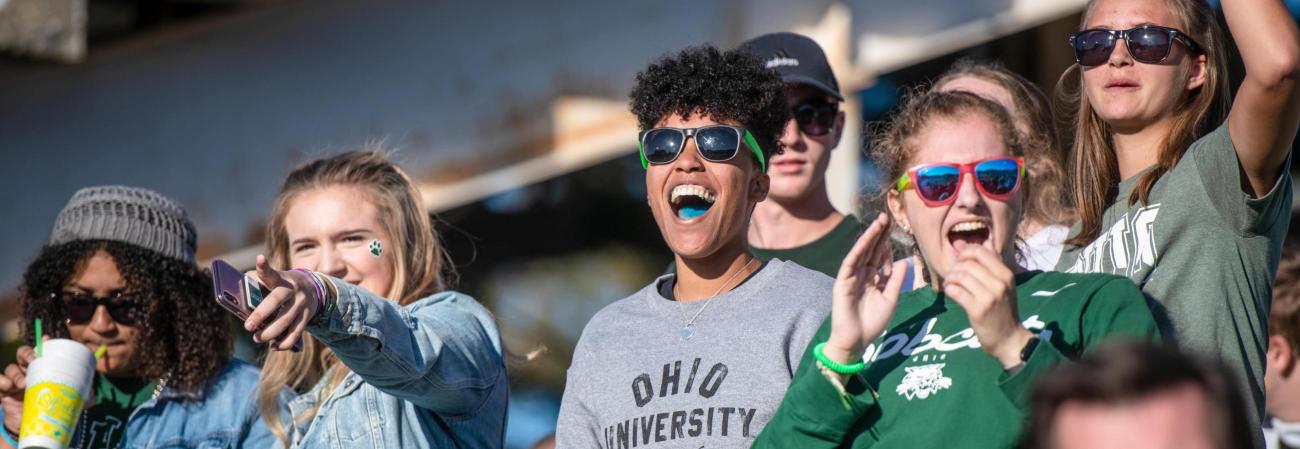 Students cheering at a football game