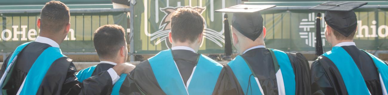 Students pose at graduation