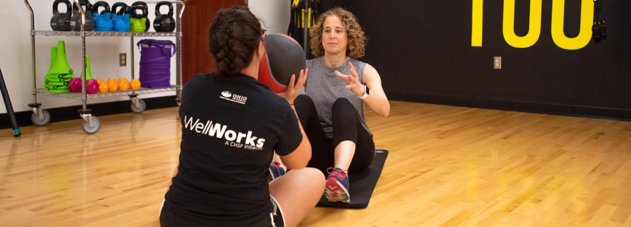 Personal trainer with client