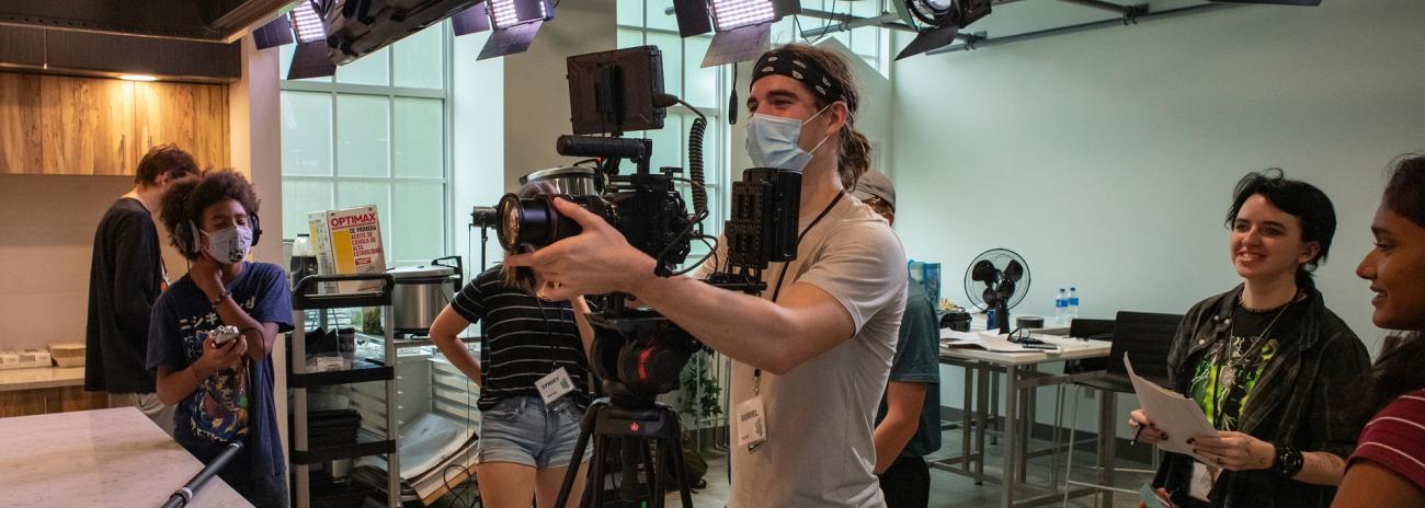 Students work with a video camera