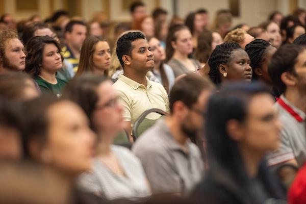 Graduate students sit and listen to presentations during Graduate Student Orientation
