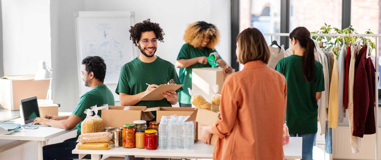 Workers accepting donations in a white room