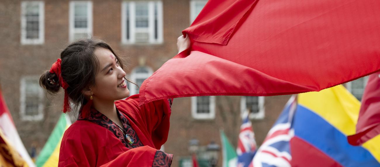 Student on College Green celebrating International Week 