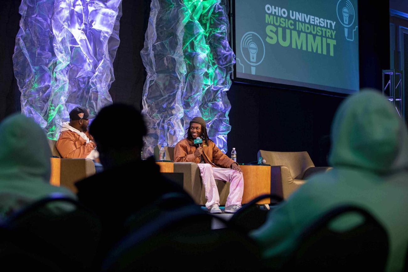 Saba on stage talking