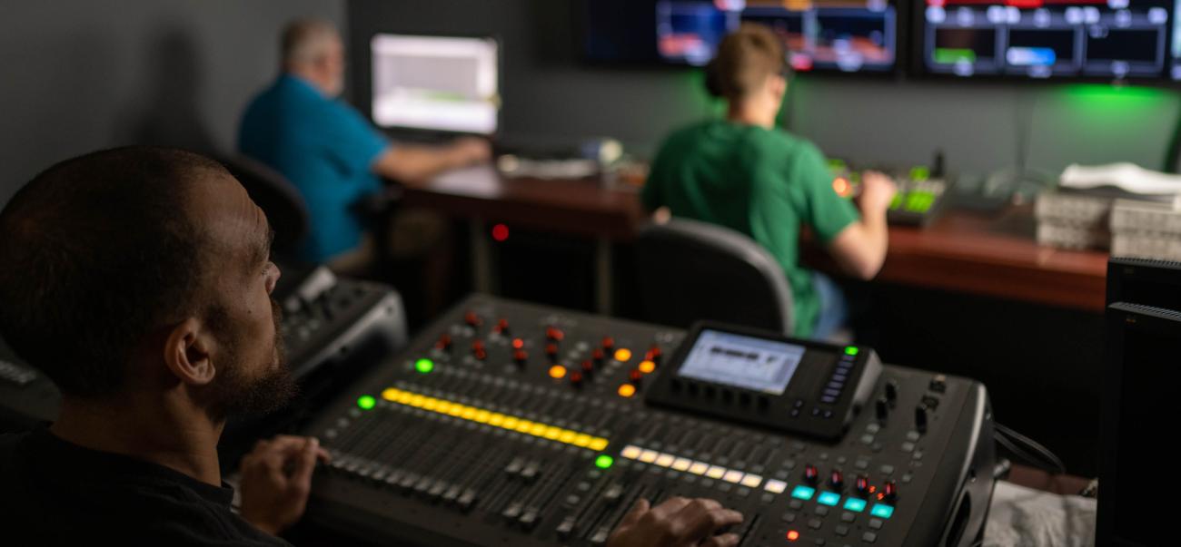 Students using equipment in electronic media studio