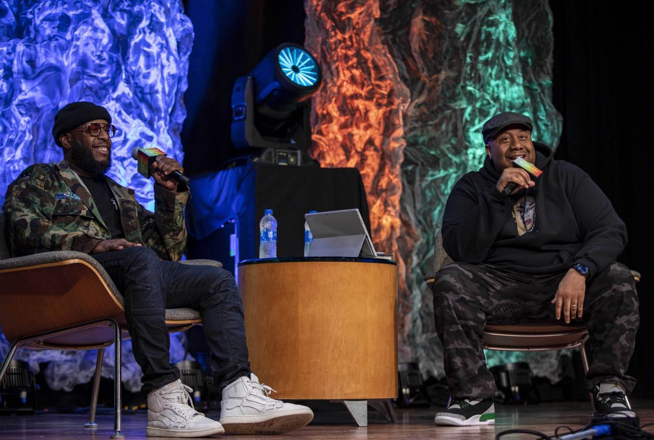 Talib Kweli and Jason Rawls on stage talking