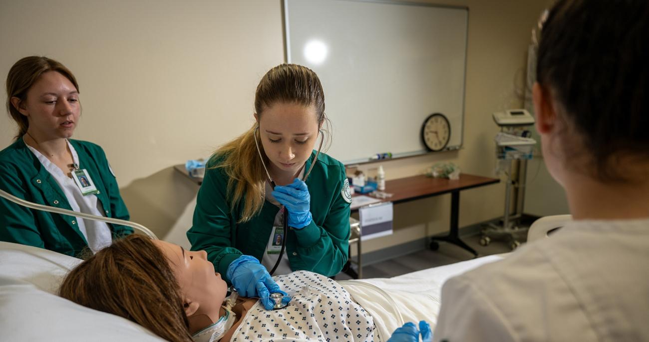 Nursing students practice skills
