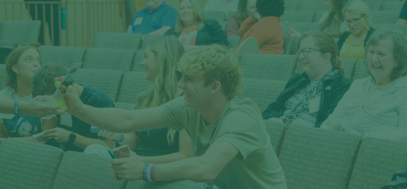 Group of people in auditorium interacting