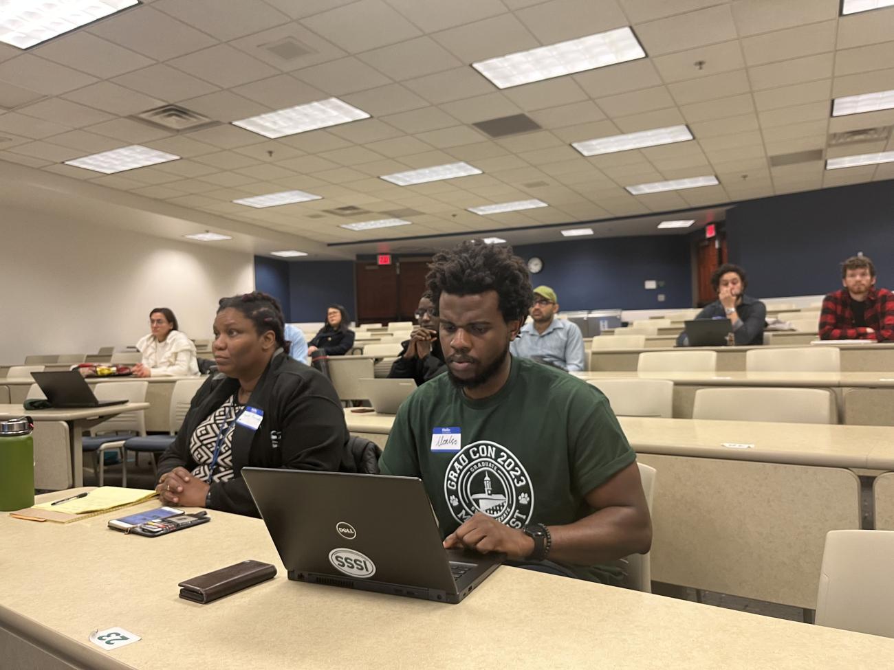 GSS member taking notes during a meeting