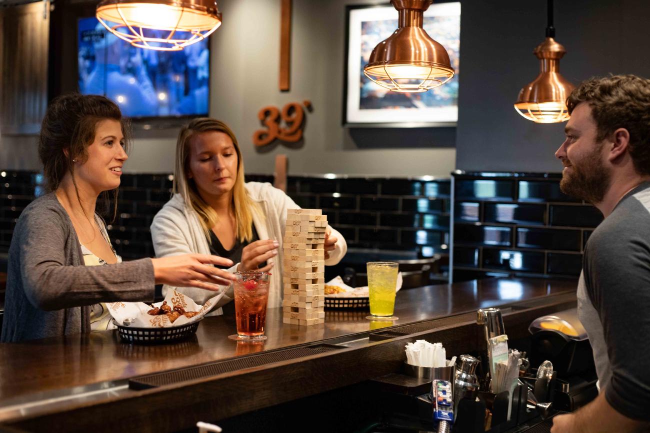 Two staff members dine at Latitude 39