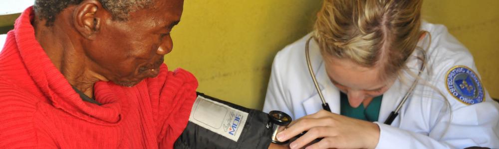 Student taking blood pressure in Botswana