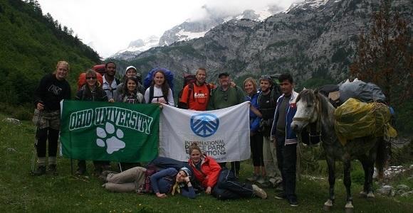 people holding ohio university flag