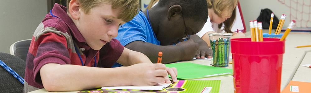 Kids color a coloring page.