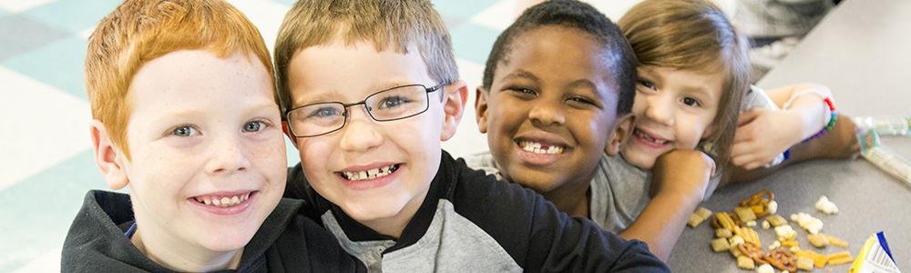 Plains Elementary kids smile for camera.