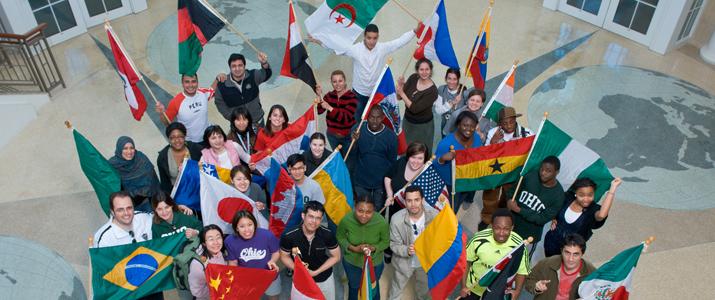 Students holding country flags in Baker Center