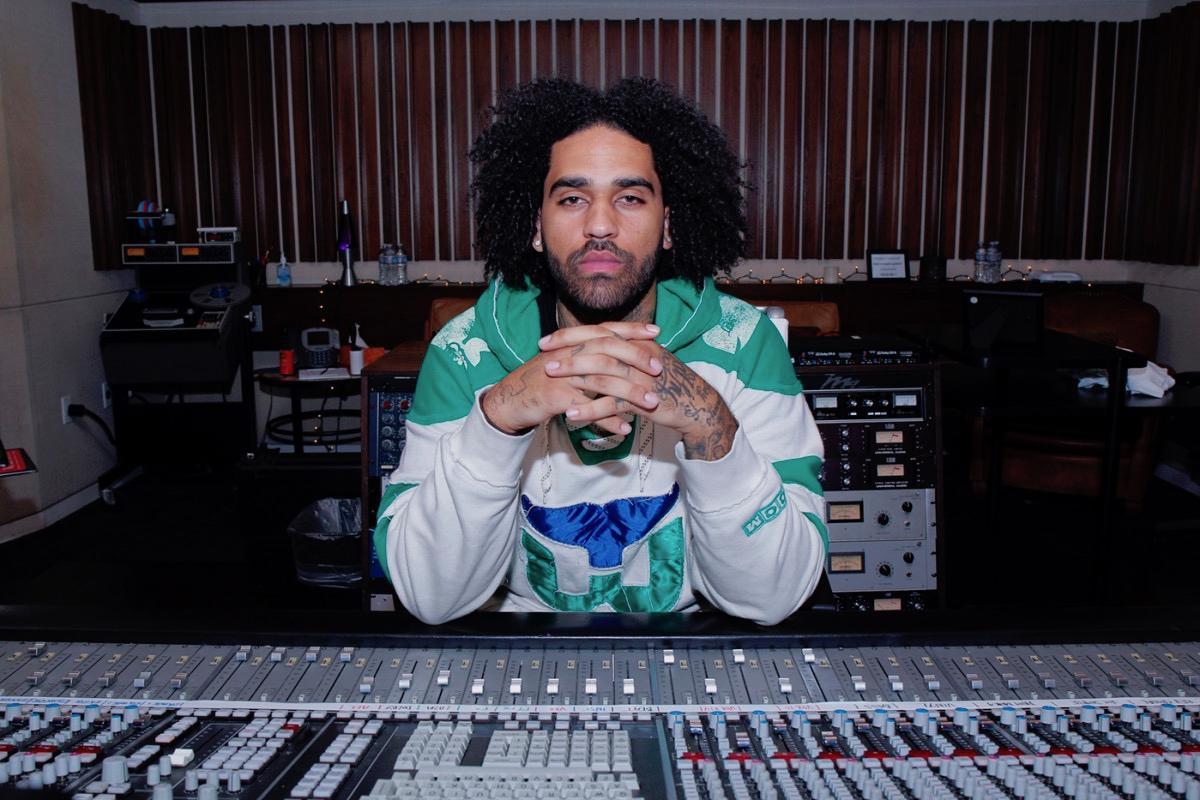 Derek Ali sitting in front of a keyboard