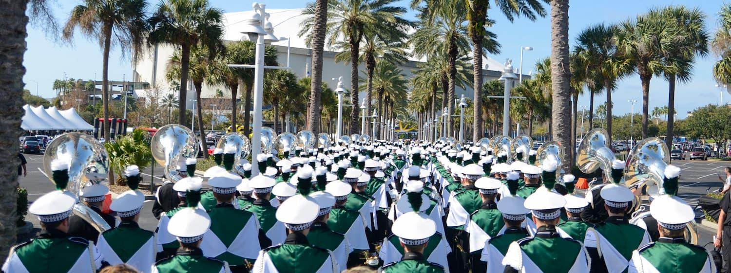 Marching band marching in lines prior to a performance in California