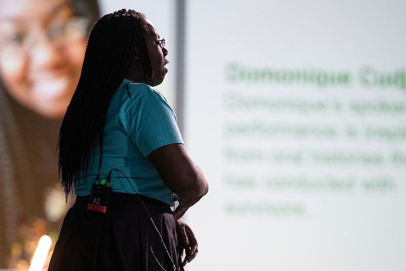 A speaker tells her story at the event
