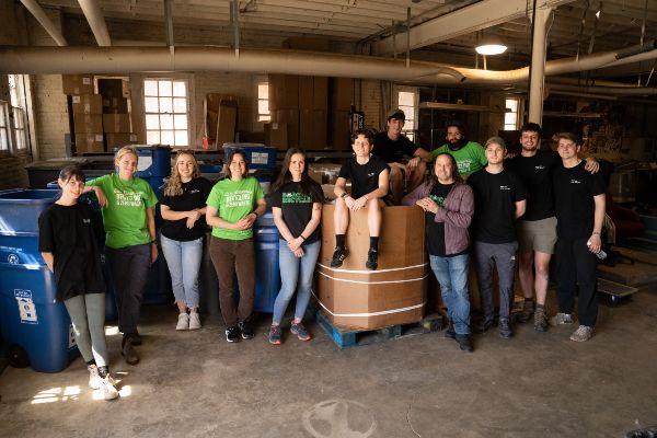 image of recycling staff inside of their shop 