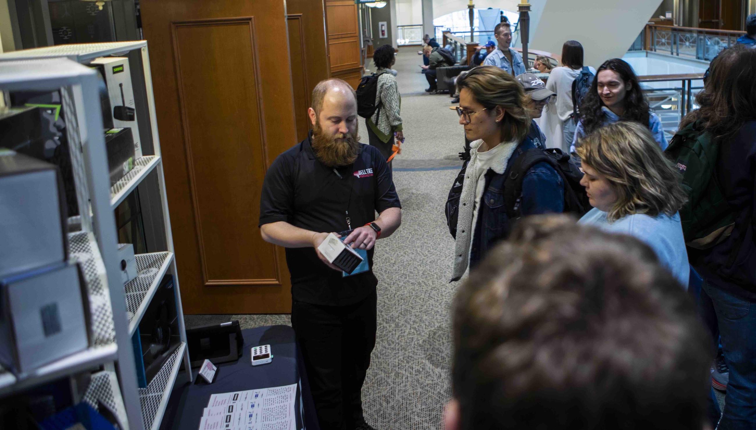 Student talking to Bell Tree Production representative