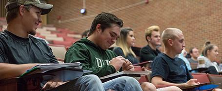 Students listening during a lecture in a classroom inside Morton Hall