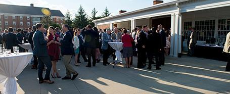 Outside the Nelson Commons building, set up with standing tables for an event