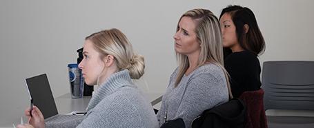 People listening to a presentation inside a room in Jefferson Hall