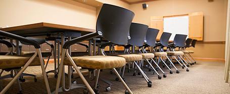 Baker Conference Room chairs, table, and presentation whiteboard