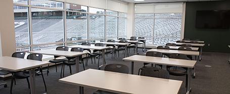 Tables and chairs set up inside a room in Sook Center